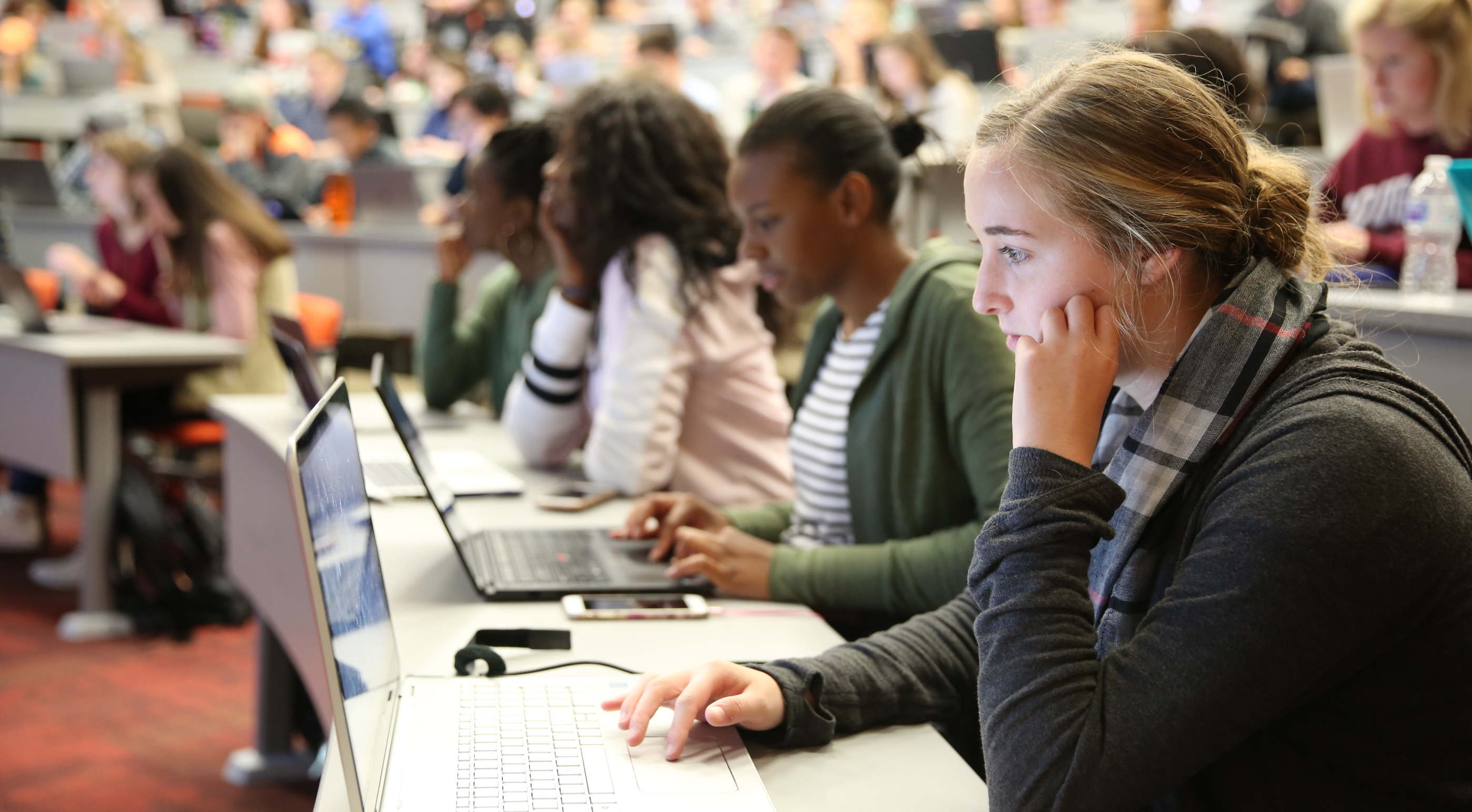 picture of students using laptops in a classroom